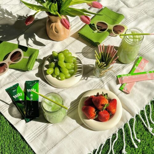 Pocky Double Rich Matcha and Cherry Blossom Matcha on the picnic blanket outdoor