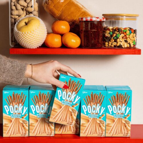 Pocky Peanut Butter boxes on the red pantry shelf.